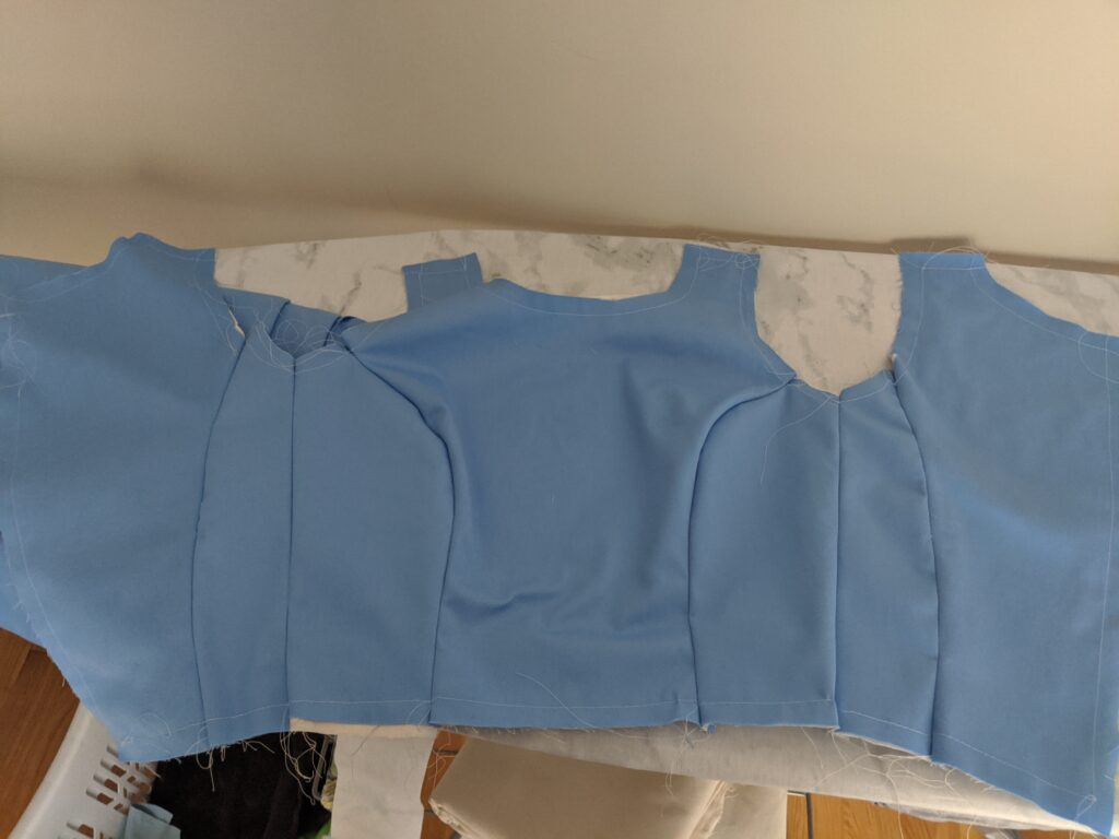 A flat-lay of the pieces for a blue dress bodice, yet to be sewn.
