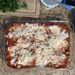 Lasagne in a glass pan, before baking