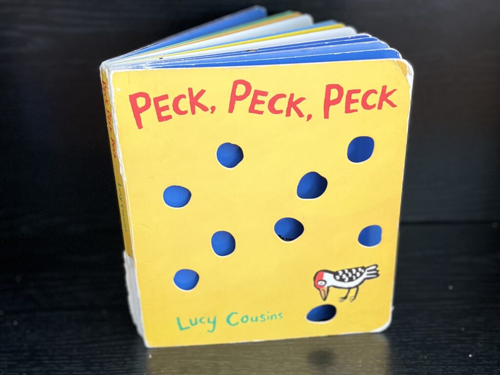Close-up of the board book Peck, Peck, Peck