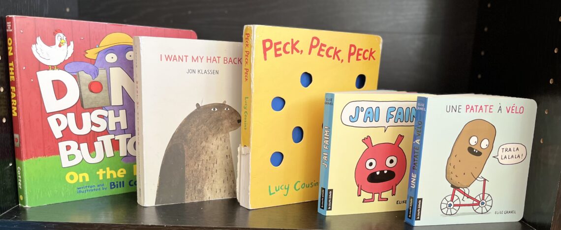 The five board books recommended in this post on display on a shelf.