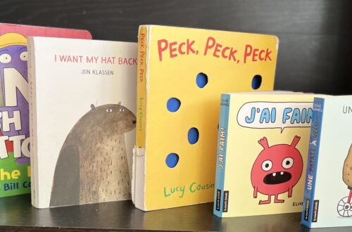 The five board books recommended in this post on display on a shelf.